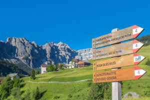 Puez-Geisler Nature Park, signpost tables near the villages of Miscì and Seres with the Puez group in the background, Lungiarü / Campill, San Martin de Tor, Bolzano, South Tyrol, Italy Puez-Geisler Nature Park, signpost tables near the villages of Miscì and Seres with the Puez group in the background, Lungiarü / Campill, San Martin de Tor, Bolzano, South Tyrol, Italy